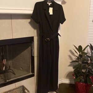 Black jumpsuit with a tie waist with a tiger eye buckle in Large. NWT